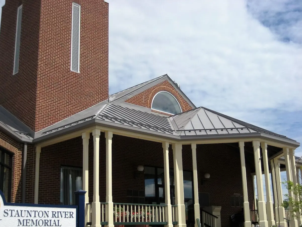 Skilled roofing craftsmen working on a residential roof in Winslow